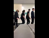 Four guys turn around and slap butts