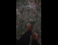 Man steps on frozen grass satisfying sound