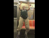 Older guy doing pull ups on subway 