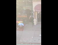 Guy rolls on ground drum on face