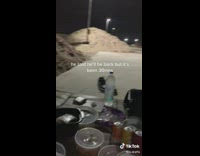 Person on beach trying to have date at night 