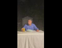 Blue shirt guy eats food rain backyard 