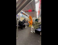 Giant chicken sells egg inside the subway