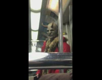 Man in scary demon horn   SFX makeup has split two tongues on subway train