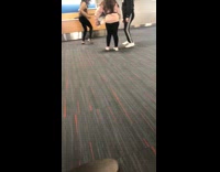 Girls jump for picture airport