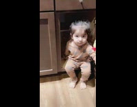 Toddler hides in cabinet 