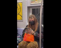 Woman wears face mask incorrectly 