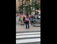 Sumo wrestlers fight for sidewalk video shoot