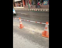 Man shows rain on other road lane