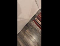 Metal silver scissors under white door 