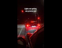 Honking red car green light