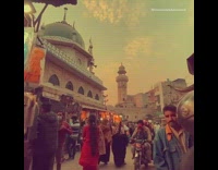 Guy walks through street market stores 