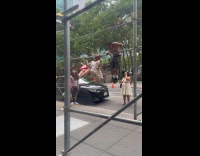 Men doing pull ups on scaffolding