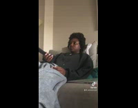 GIrl shows back of hair is flat from sitting on couch 