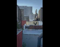 Pink toy left out on apartment rooftop