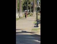 Woman and man in jesus costume tiktok on the park