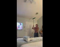 Guy tries to catch bird in room