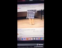 Girl tries to wear pants as dress  