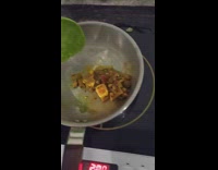 Frozen green paste on the spoon used to cook