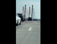 Collab WINY - Man on motorcycle pushing another motorcycle on highway