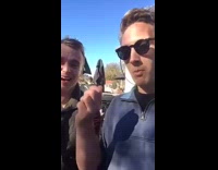 guy in blue shirt eats cigarette 