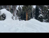 Guy snowboarding tries to jump hits back