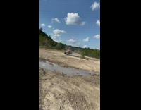 Orange dune buggy sharp turn tips over 