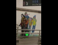 Oiled clown mask workout guy standing at subway station