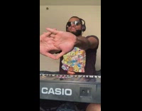 Black nickelodeon shirt guy plays keyboard sings