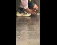 Man Cuts Foot Nails in Subway Train
