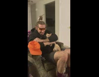 Two pet cat hugged tightly by the man