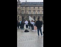 large crowd kids glass pyramid 