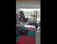 Two men used as additional weights gym