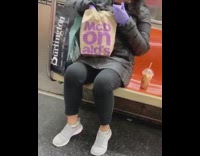 Lady eats mcdonalds fries purple gloves train