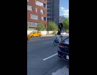 Guy white top balance tire on head