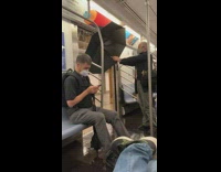 Man holds umbrella leaking subway doors pt 2