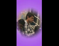 man in white shirt sleeps on man with blue flannel 