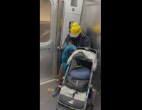 Man on subway with eagle wrapped in blanket 