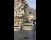 Girl black shirt wave hair fountain statues