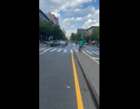 Woman swings censer in middle of road