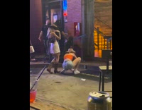 2 blonde ladies in cowboy hats dance drunk to country 