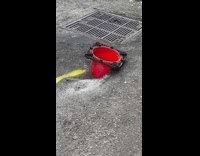 Upside down traffic cone stuck in pavement