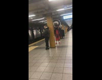 man in traditional native american clothing waiting for train