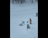 Woman snowboard pose while person kicks snow