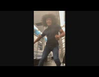 Guy alone on subway train dances to September 