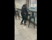 Guy in store dance hold food container