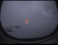 Airplane plane flies downwards city lights window 