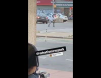 White shirt grey pants lady dances street