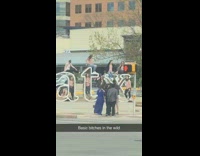 Girls pose on atx sign pink shirts