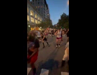 Large group of skaters on street night